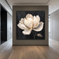 Ivory Magnolia artwork displayed on a charcoal entryway wall.