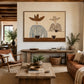 Saddlebreak Coffee artwork displayed above a console in a rustic living room.