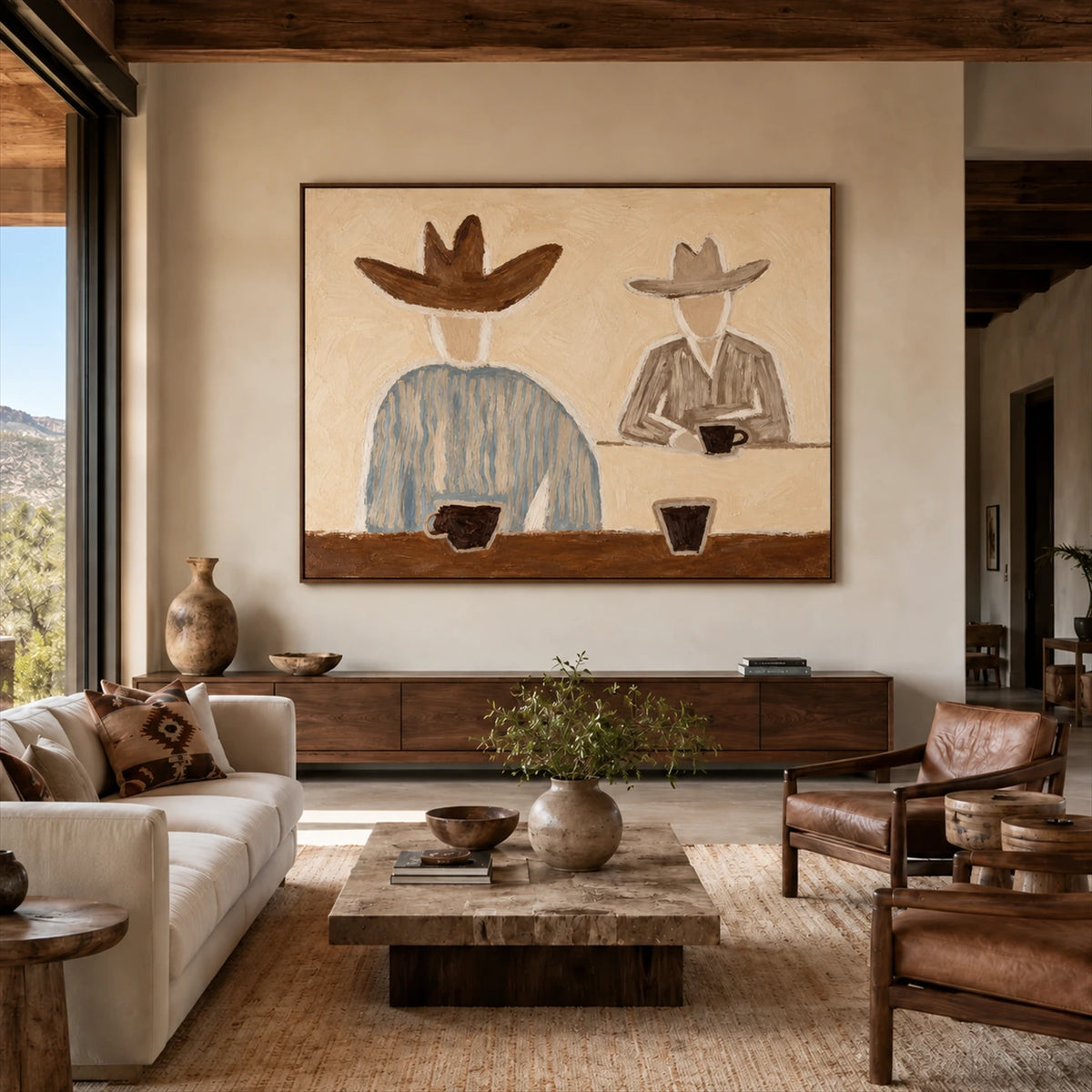 Saddlebreak Coffee artwork displayed above a low cabinet in a sunlit lounge.