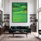 Emerald Fairways artwork displayed above a deep green sofa in a bright lounge.