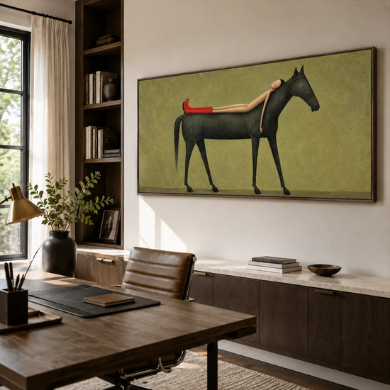 Scarlet Boot Siesta artwork displayed above a low cabinet in a sunlit study.