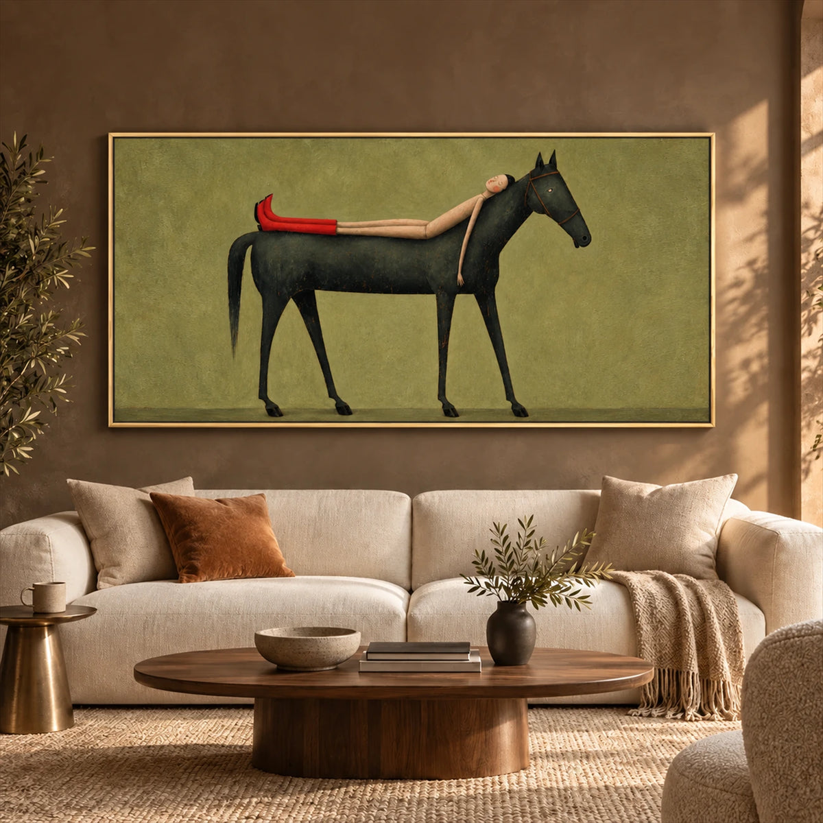Scarlet Boot Siesta artwork displayed above a sofa against an earthy accent wall.