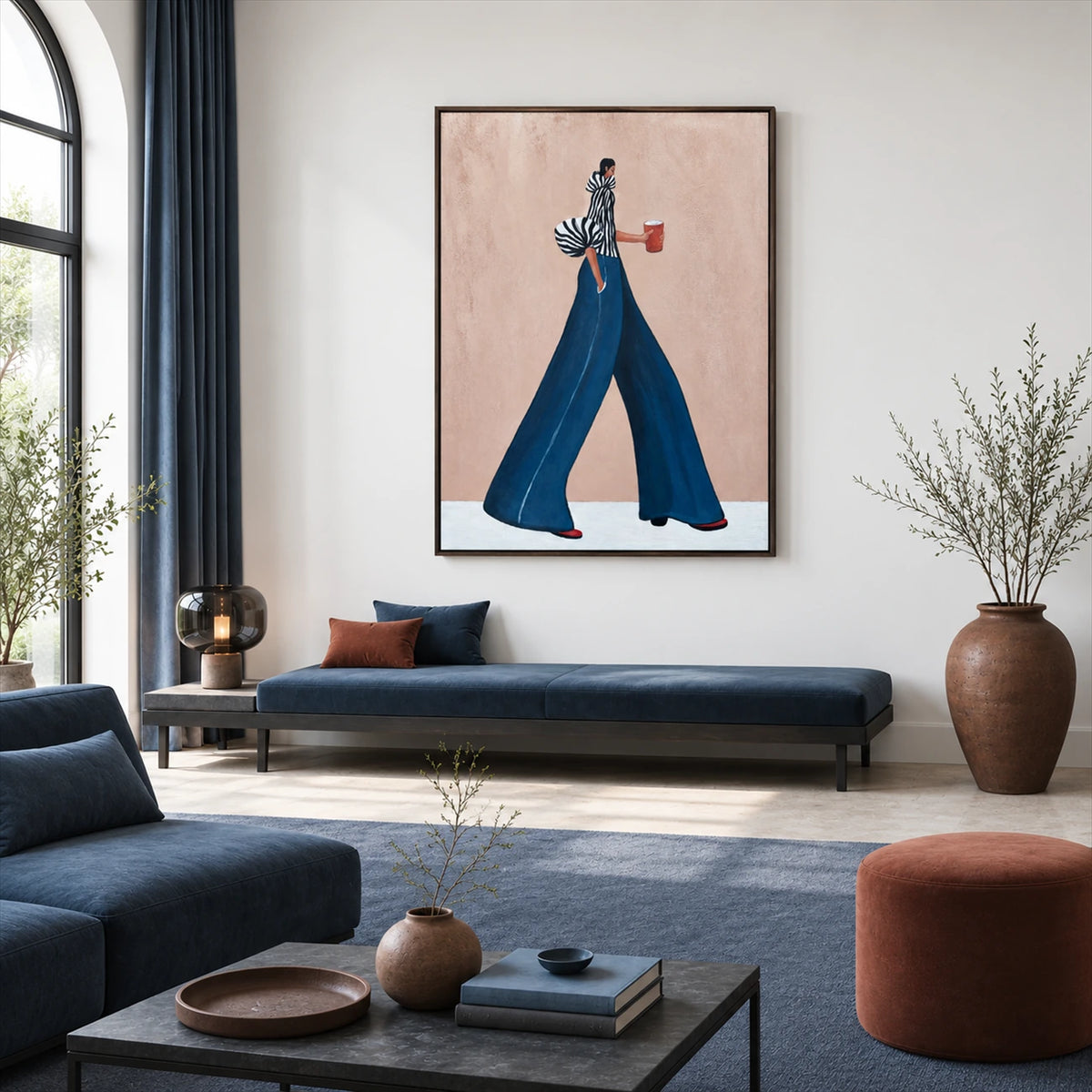 Indigo Stride artwork displayed above a navy bench beside a tall window.