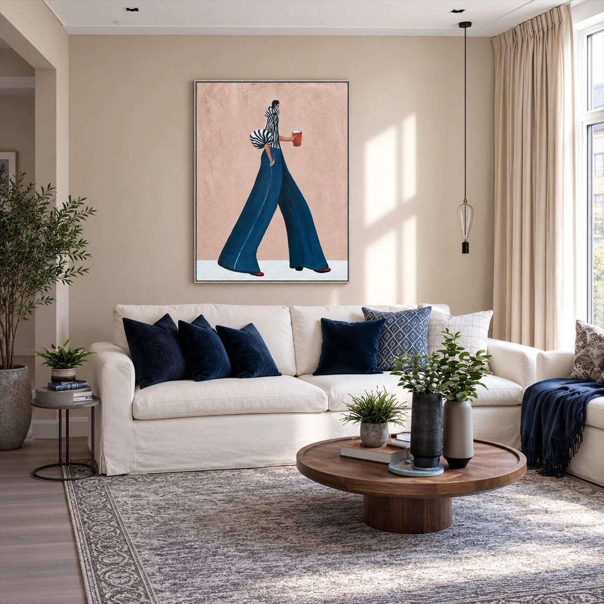 Indigo Stride artwork displayed above a cream sofa with blue cushions.