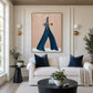 Indigo Stride artwork displayed above a cream sofa between paneled walls.