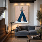 Indigo Stride artwork displayed above a gray sofa beside a staircase.