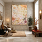 Amber Traces artwork displayed above a sofa in a warm stone interior.