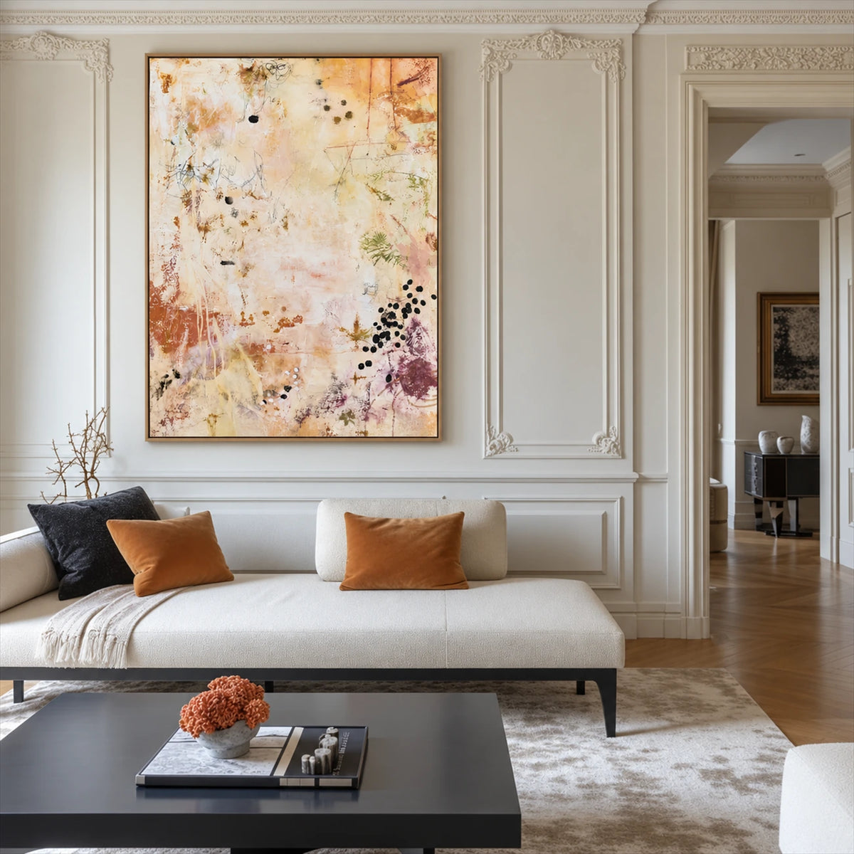 Amber Traces artwork displayed above a white sofa against paneled walls.