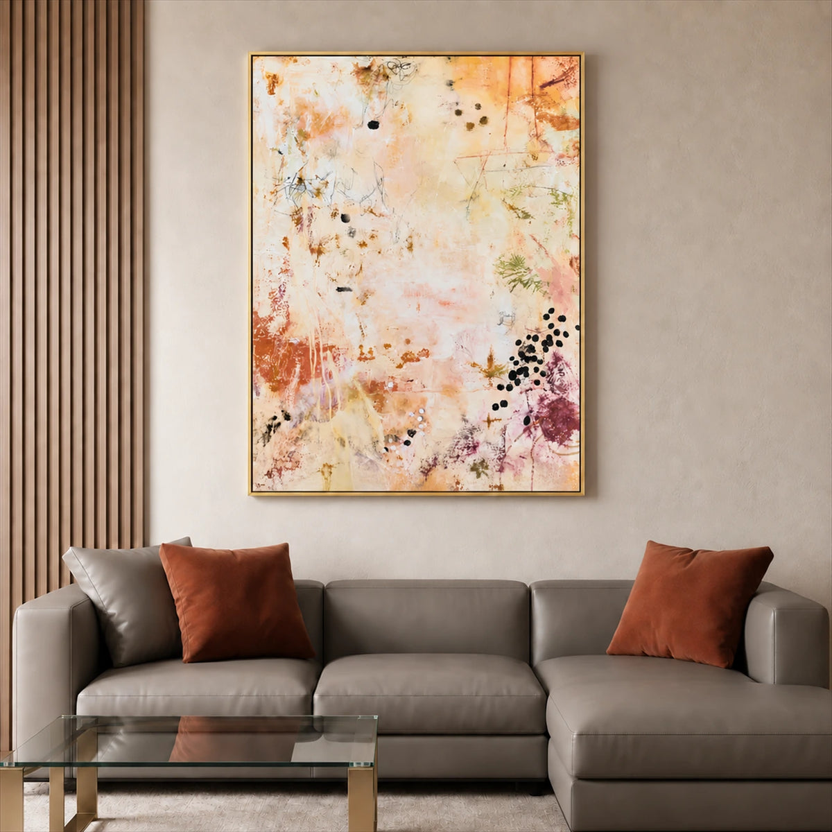 Amber Traces artwork displayed above a gray sofa beside vertical wood panels.