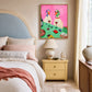 Bistro Ducks artwork displayed beside a blue headboard and yellow bedside table.