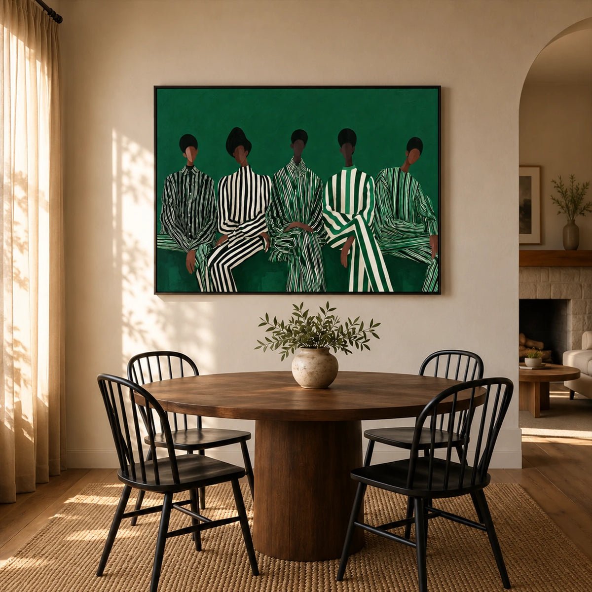 Emerald Assembly artwork displayed above a round dining table.