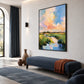 Pastel Estuary artwork displayed above a blue chaise in a bright room.