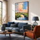 Pastel Estuary artwork displayed above a dark blue sofa.