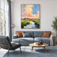 Pastel Estuary artwork displayed above a pale blue sofa beside a window.