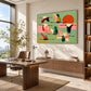 Patchwork Migration artwork displayed above a wooden desk near tall windows.