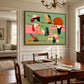 Patchwork Migration artwork displayed above a wooden dining table.