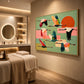 Patchwork Migration artwork displayed beside a massage table in a softly lit room.