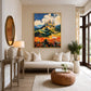 Sunlit Citadel artwork displayed above a cream sofa beside a round ottoman.