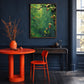 Verdant Garland artwork displayed beside a bright orange table and chair.