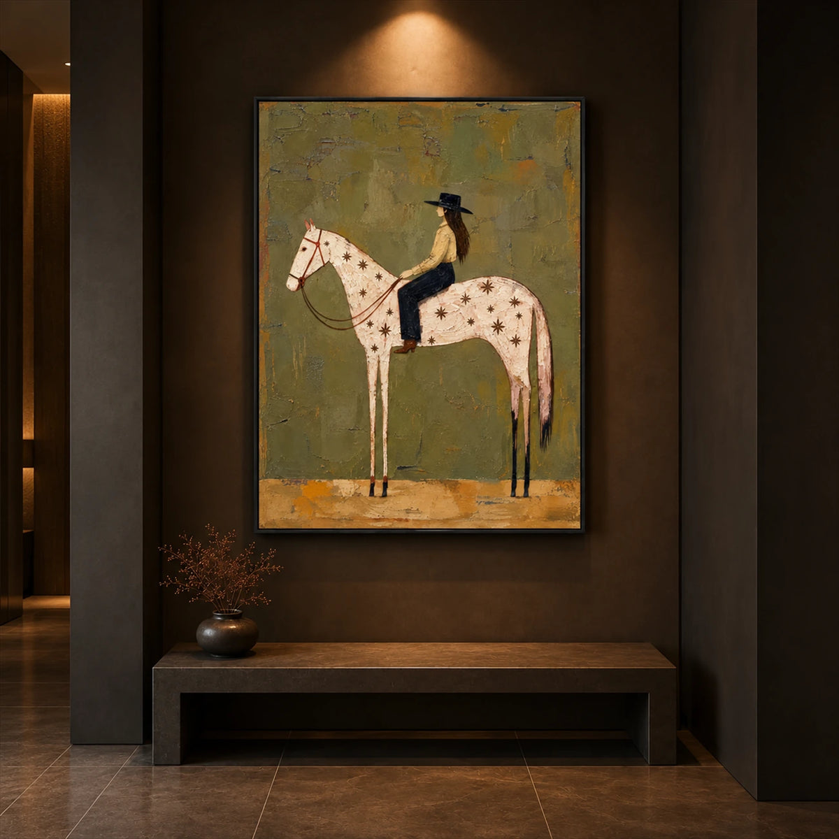 Starry Saddle artwork displayed above a bench in a dim hallway.