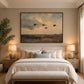 Duskbound Flight artwork displayed above a cream upholstered bed.
