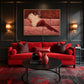 Velvet Repose artwork displayed above a red sofa between wall sconces.