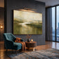 Mosslit Water artwork displayed beside a teal armchair and round table.