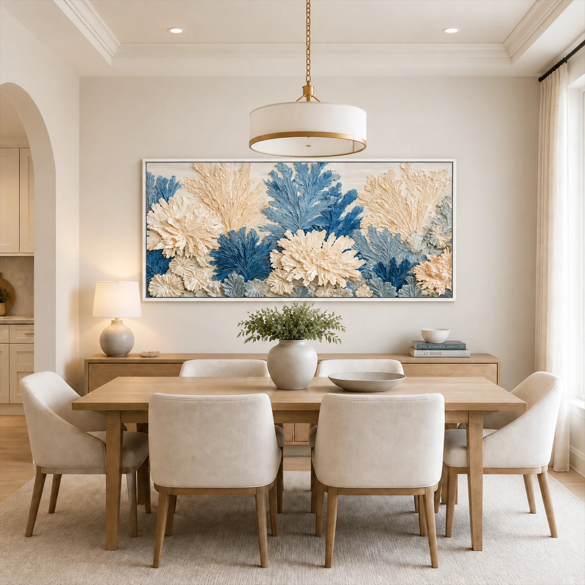 Porcelain Foliage artwork displayed above a pale dining table.