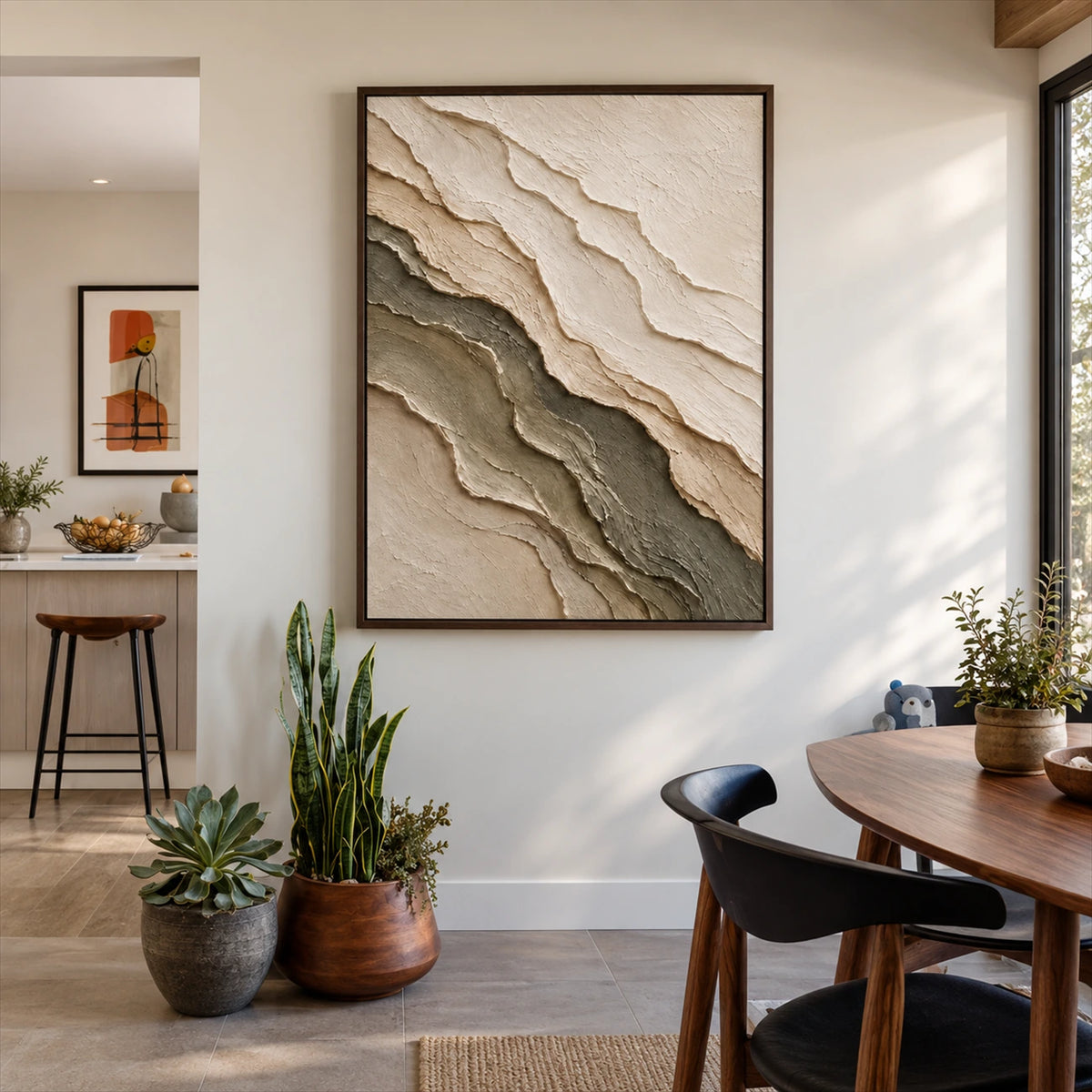 Quiet Strata artwork displayed beside a dining table and potted plants.