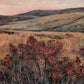 Heather Vale full artwork. Rose-colored shrubs rise in the foreground beneath rolling ochre hills and a softly pink evening sky.