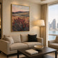 Heather Vale artwork displayed above a cream sofa near a window.