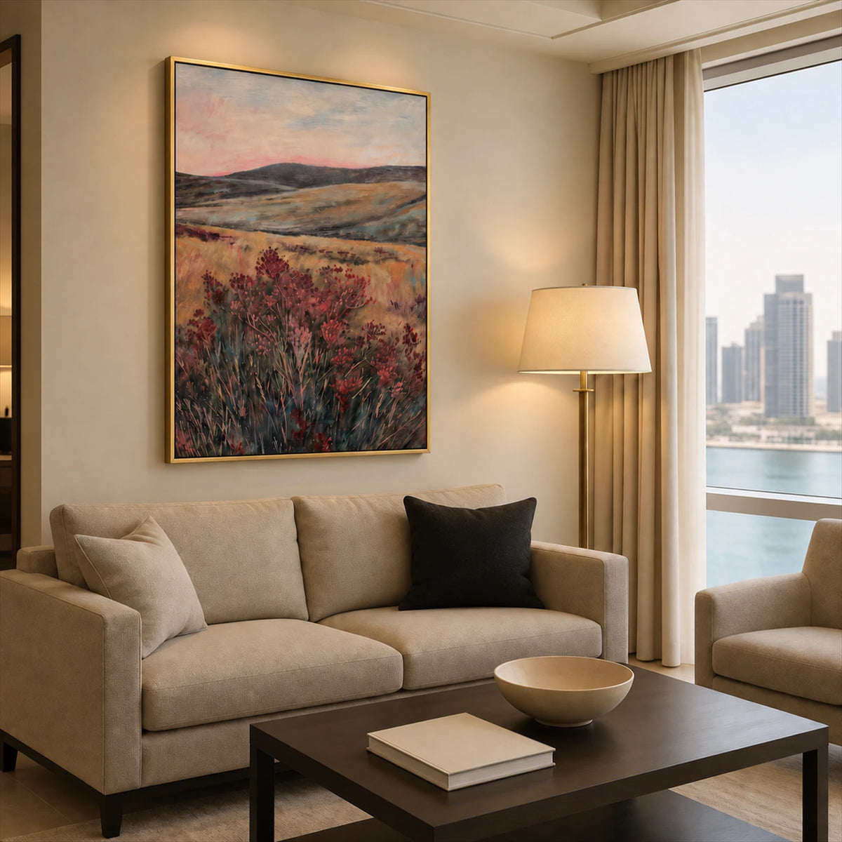 Heather Vale artwork displayed above a cream sofa near a window.