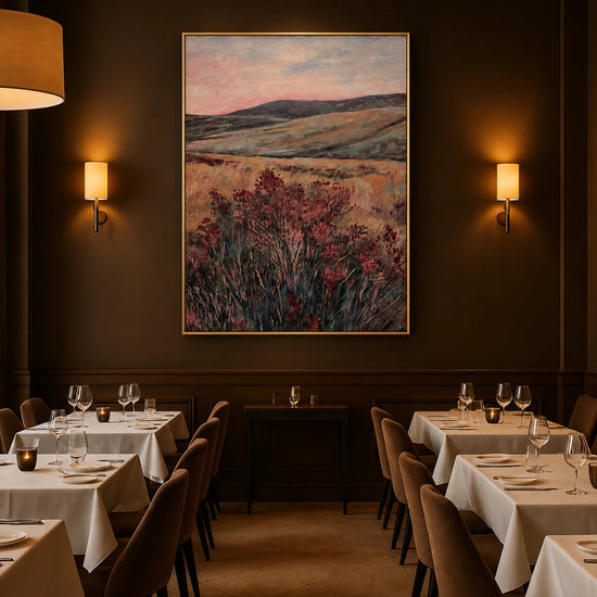 Heather Vale artwork displayed above dining tables in a softly lit restaurant.