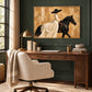 Ivory Cavalier artwork displayed above a desk against a green paneled wall.