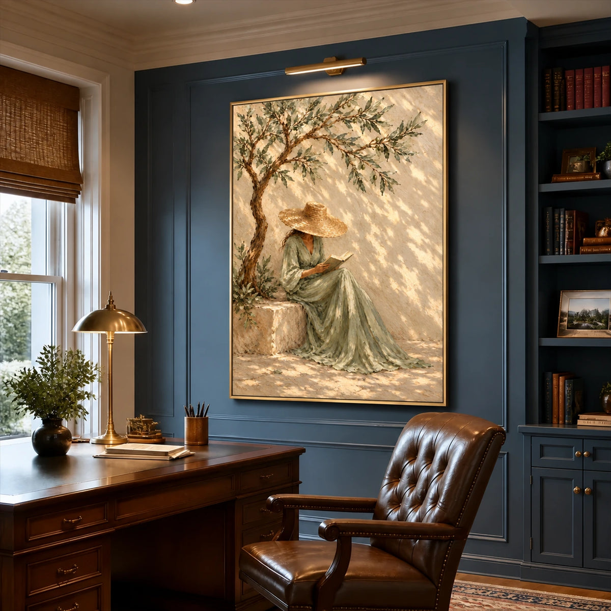 Olive Reverie artwork displayed above a desk beside blue bookshelves.