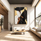 Gilded Equestrian artwork displayed above pale seating in a tall sunlit living room.