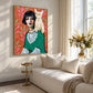 Feline Muse artwork displayed above a cream sofa near a window.