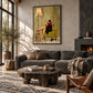 Chapter Hour artwork displayed above a gray sectional beside a fireplace.