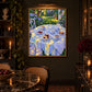 Garden Porcelain artwork displayed above a dining table beneath a picture light.