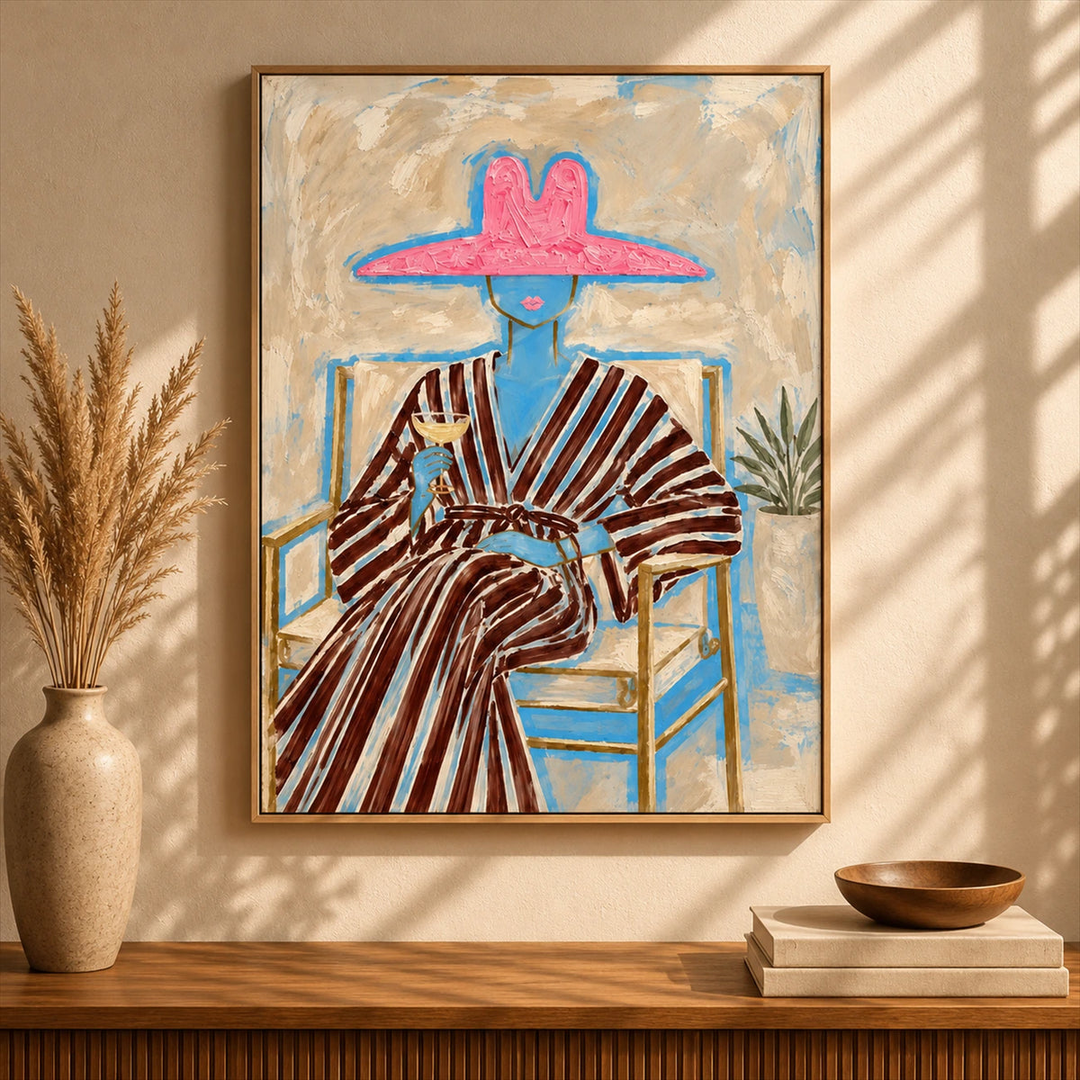Rosy Brim artwork displayed above a wooden console beside pampas grass.