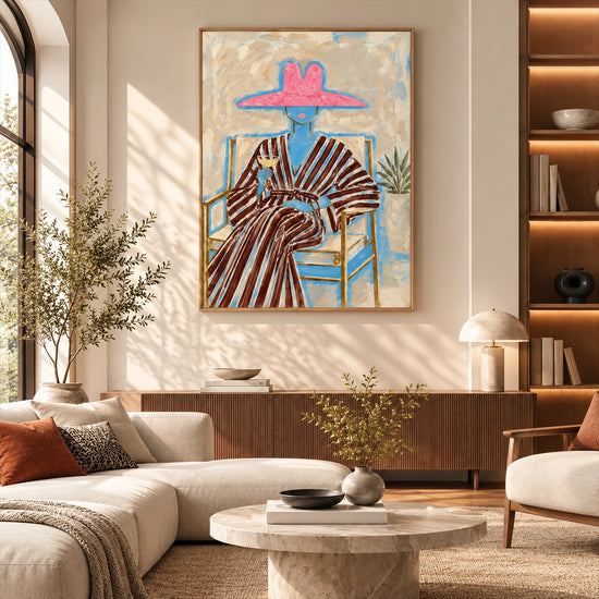 Rosy Brim artwork displayed above a long cabinet behind lounge seating.