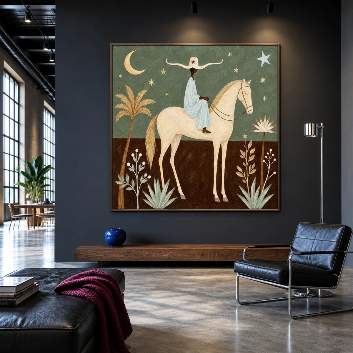 Celestial Saddle artwork displayed above a wooden bench in a dark lounge.