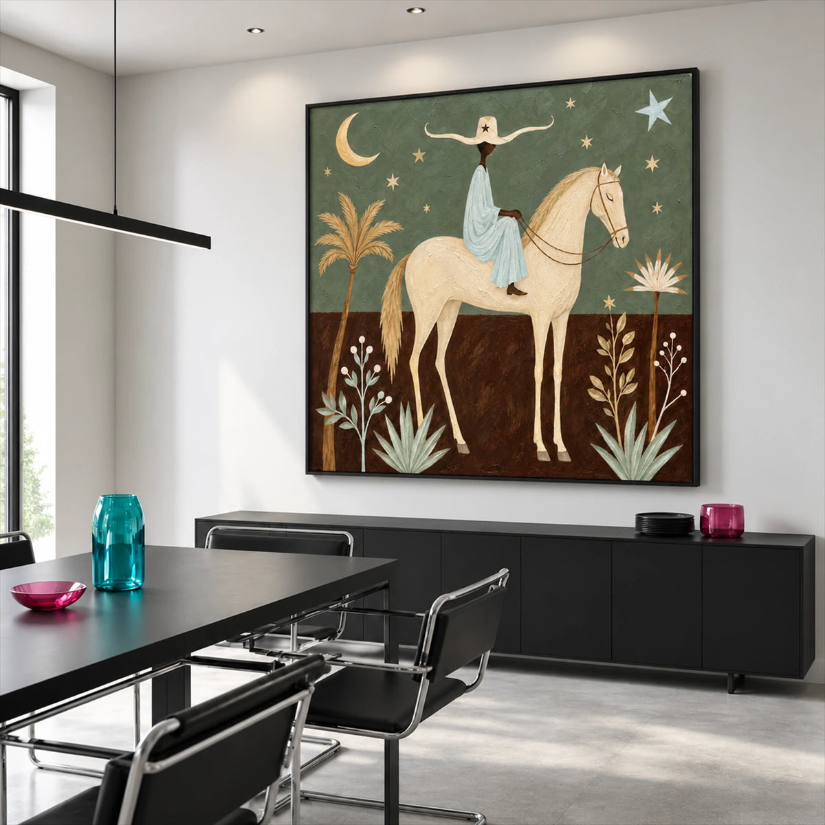 Celestial Saddle artwork displayed above a black sideboard beside a dining table.