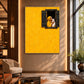 Golden Embrace artwork displayed on a tall warm wall overlooking lounge seating.