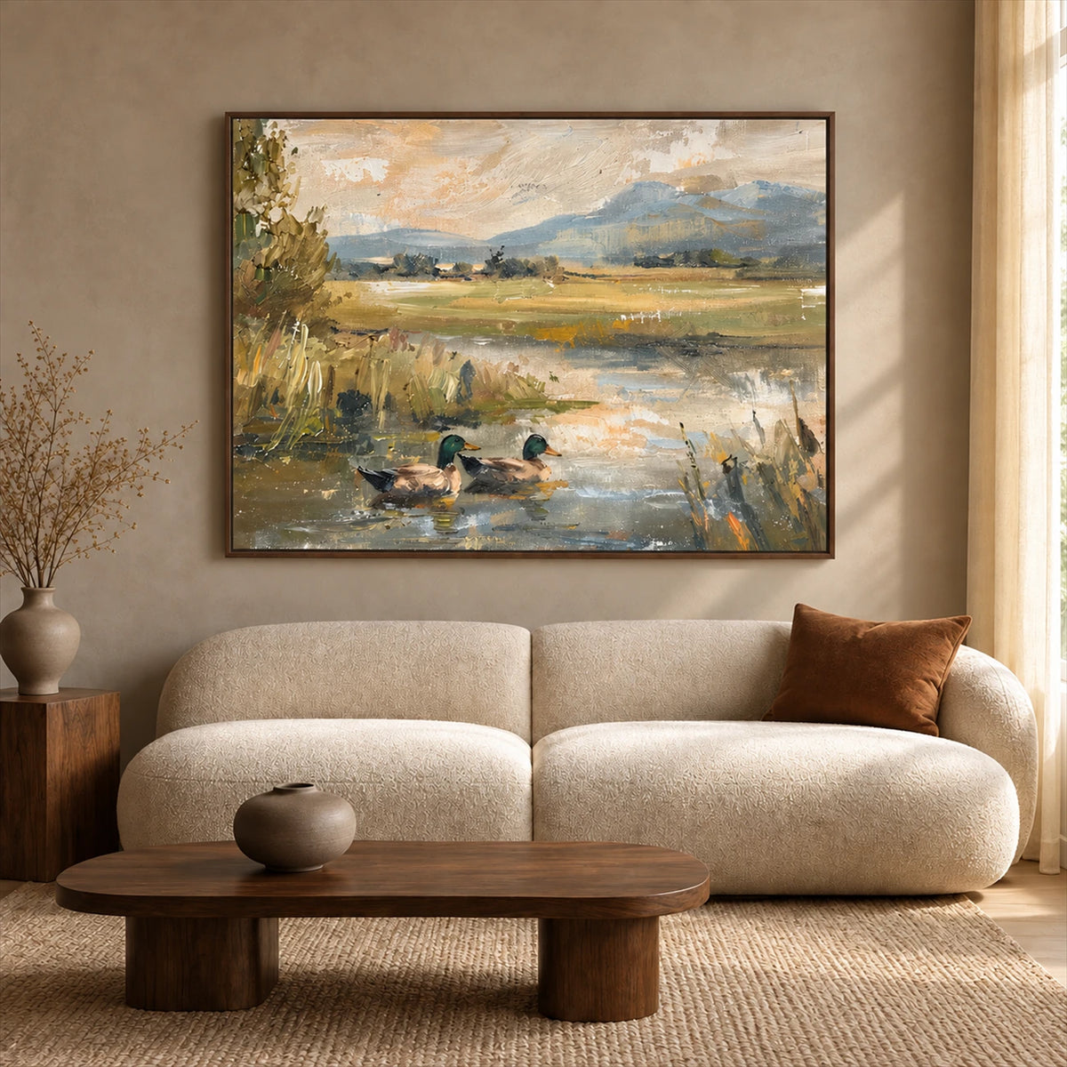 Meadow Mallards artwork displayed above a cream curved sofa.