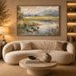 Meadow Mallards artwork displayed above a curved cream sofa near a window.