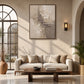 Ivory Fragments artwork displayed above a cream sofa near an arched window.