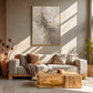 Ivory Fragments artwork displayed above a cream sofa and wooden table.