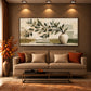 Olive Vessel artwork displayed above a brown sofa.