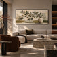 Olive Vessel artwork displayed above a cream sofa and stone table.